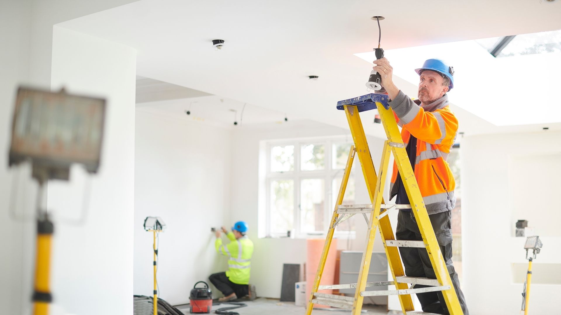 man installing light