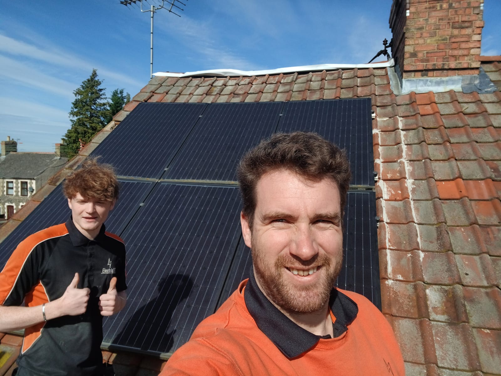 Solar panel installers in Norfolk on a roof with fitted pv panels