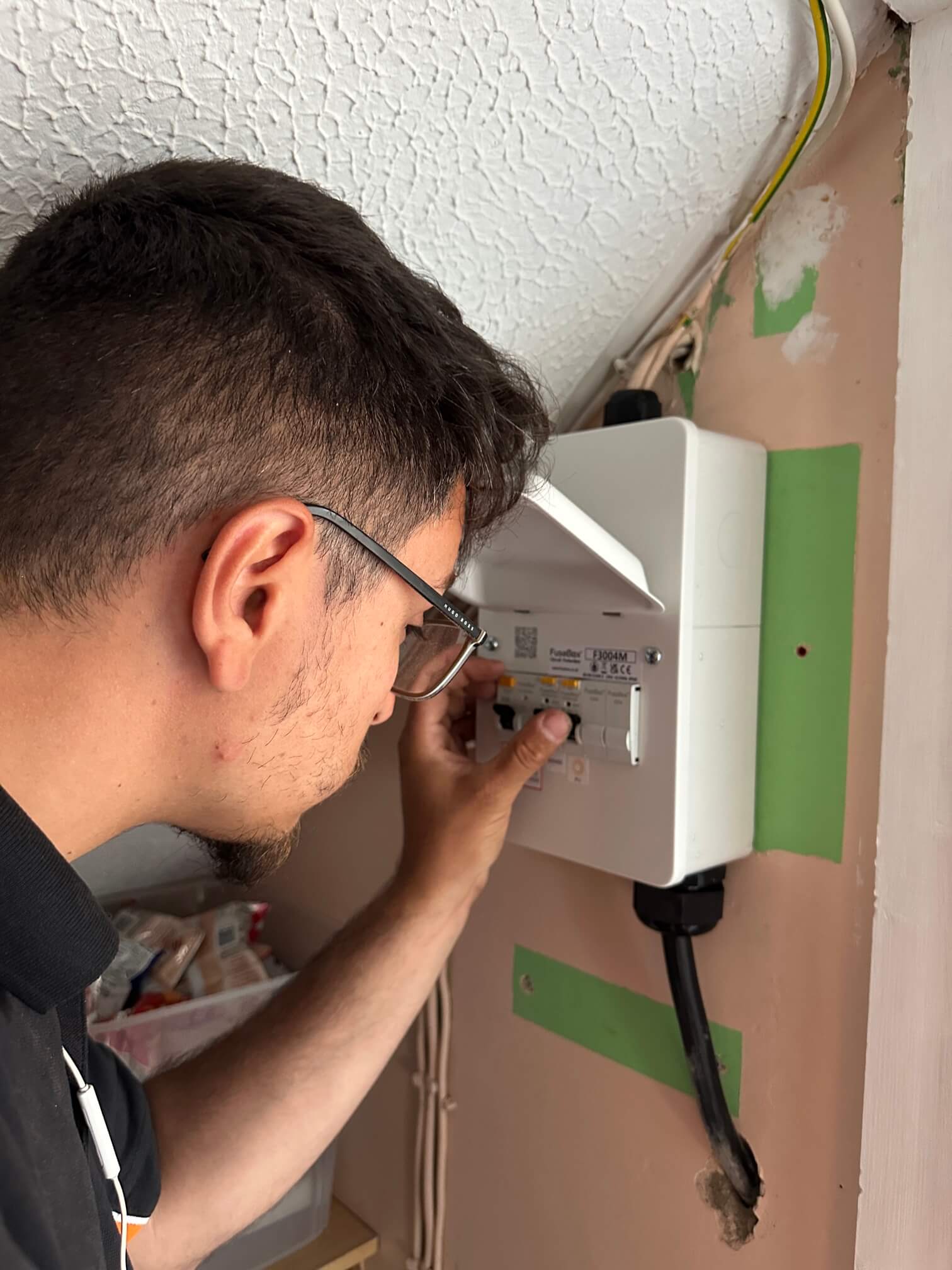 Electric11 electrician testing the dedicated solar PV consumer unit in Long Stratton