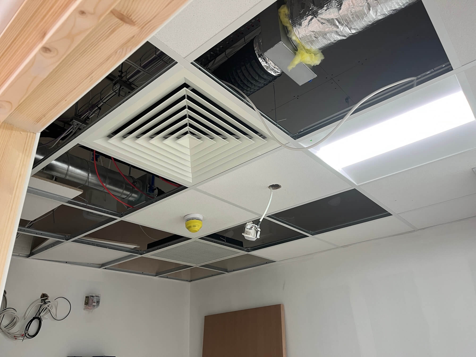 Ceiling air vent, LED panel and cabling during the Banking Hub fit-out