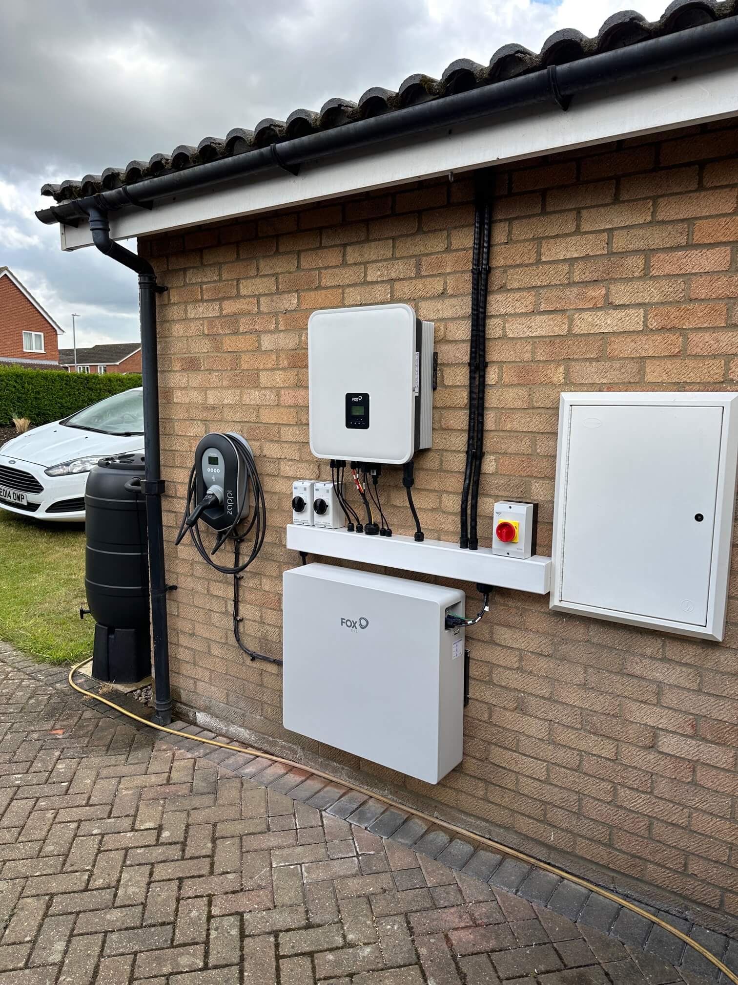 Completed Fox ESS inverter, battery and Zappi charger mounted on a bungalow