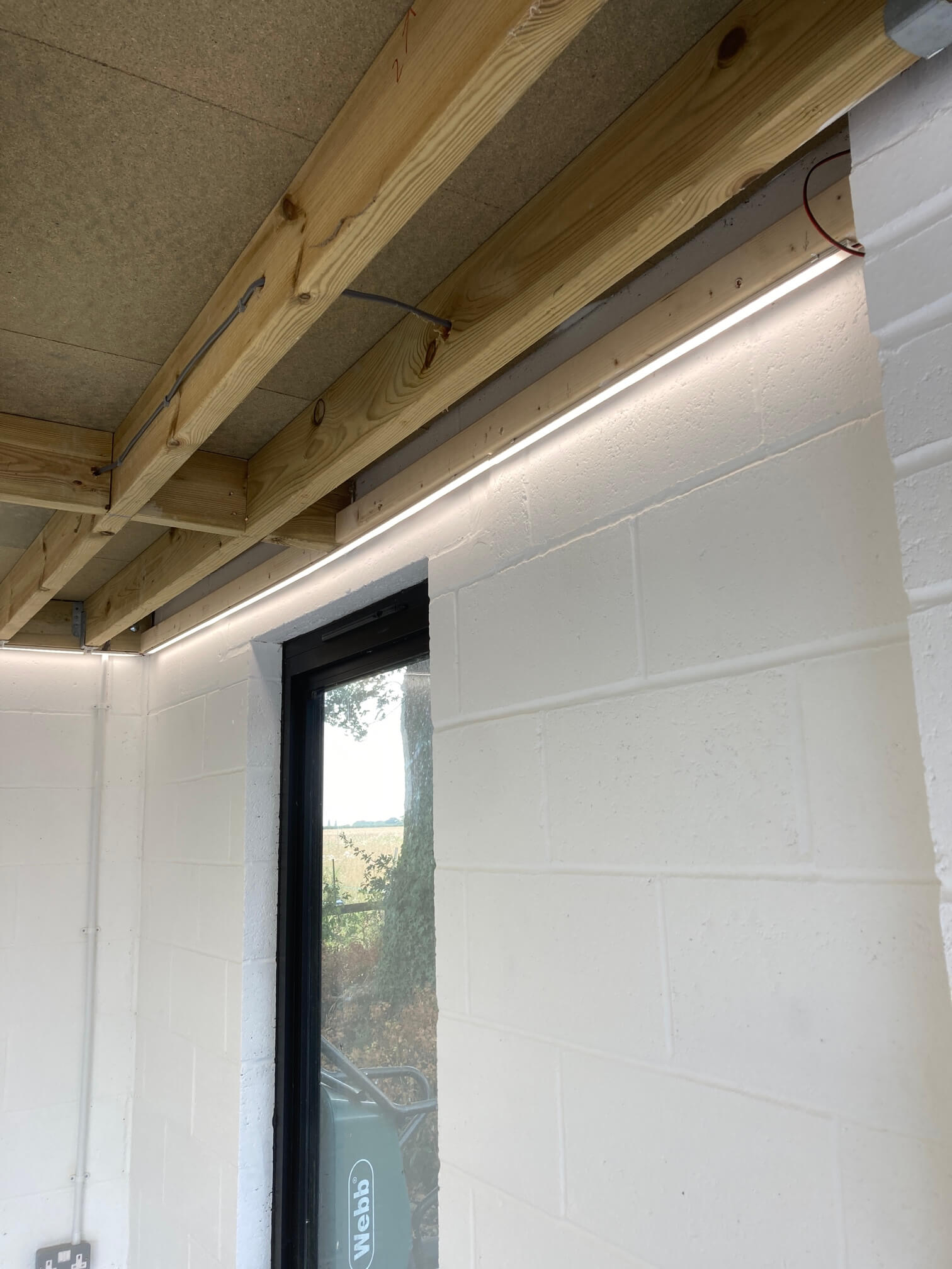 Completed LED strip lighting installed along the Bressingham garage ceiling