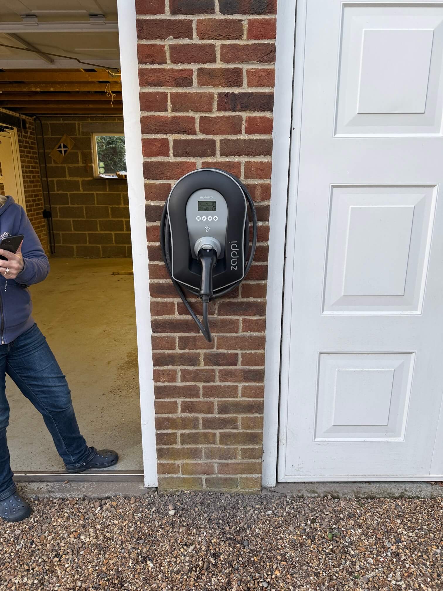 Completed Myenergi zappi EV charger installed on the detached garage wall