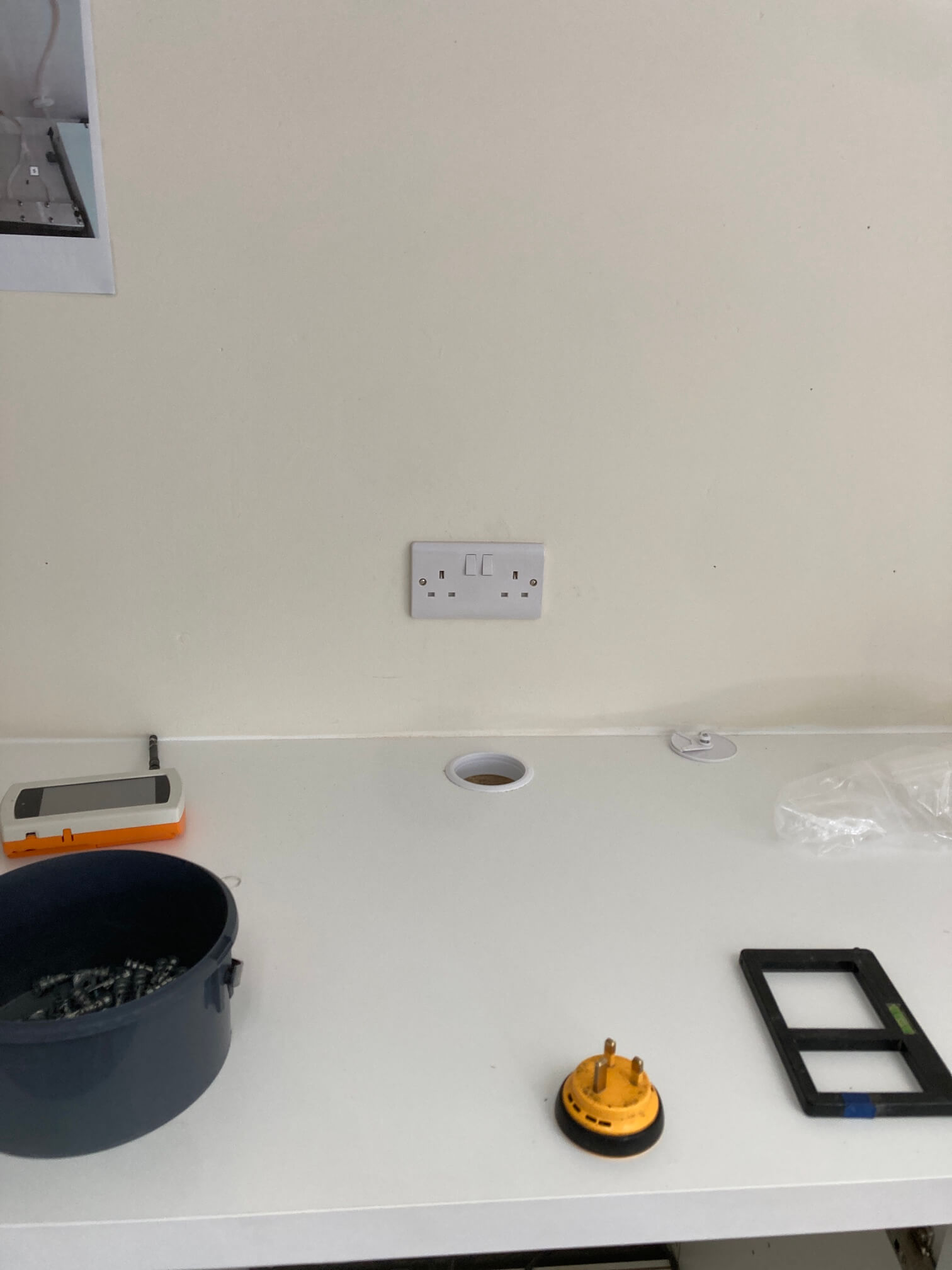Double electrical socket installed above a clean laboratory worktop