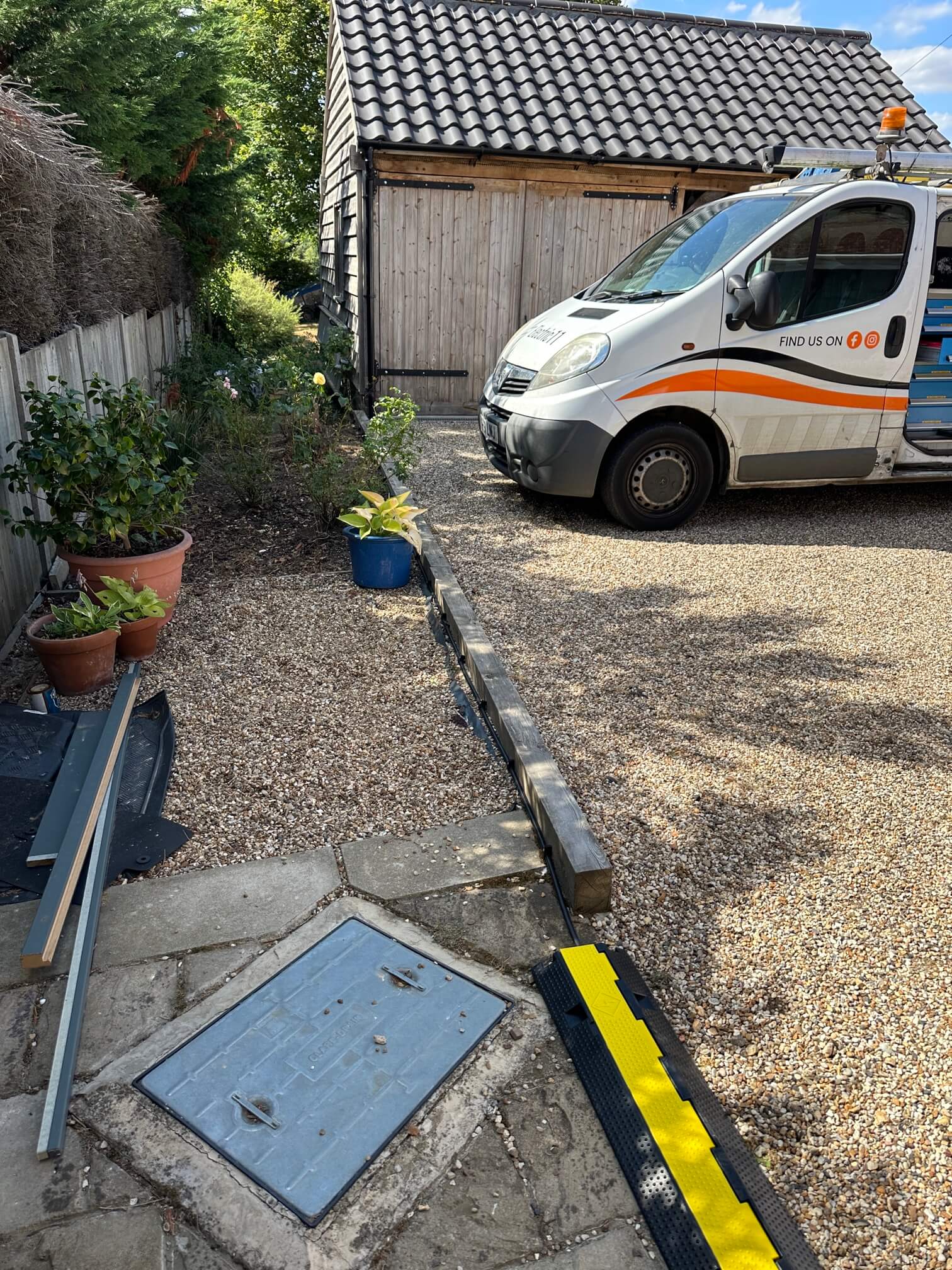Planned EV charger cable route across a gravel driveway in Norwich