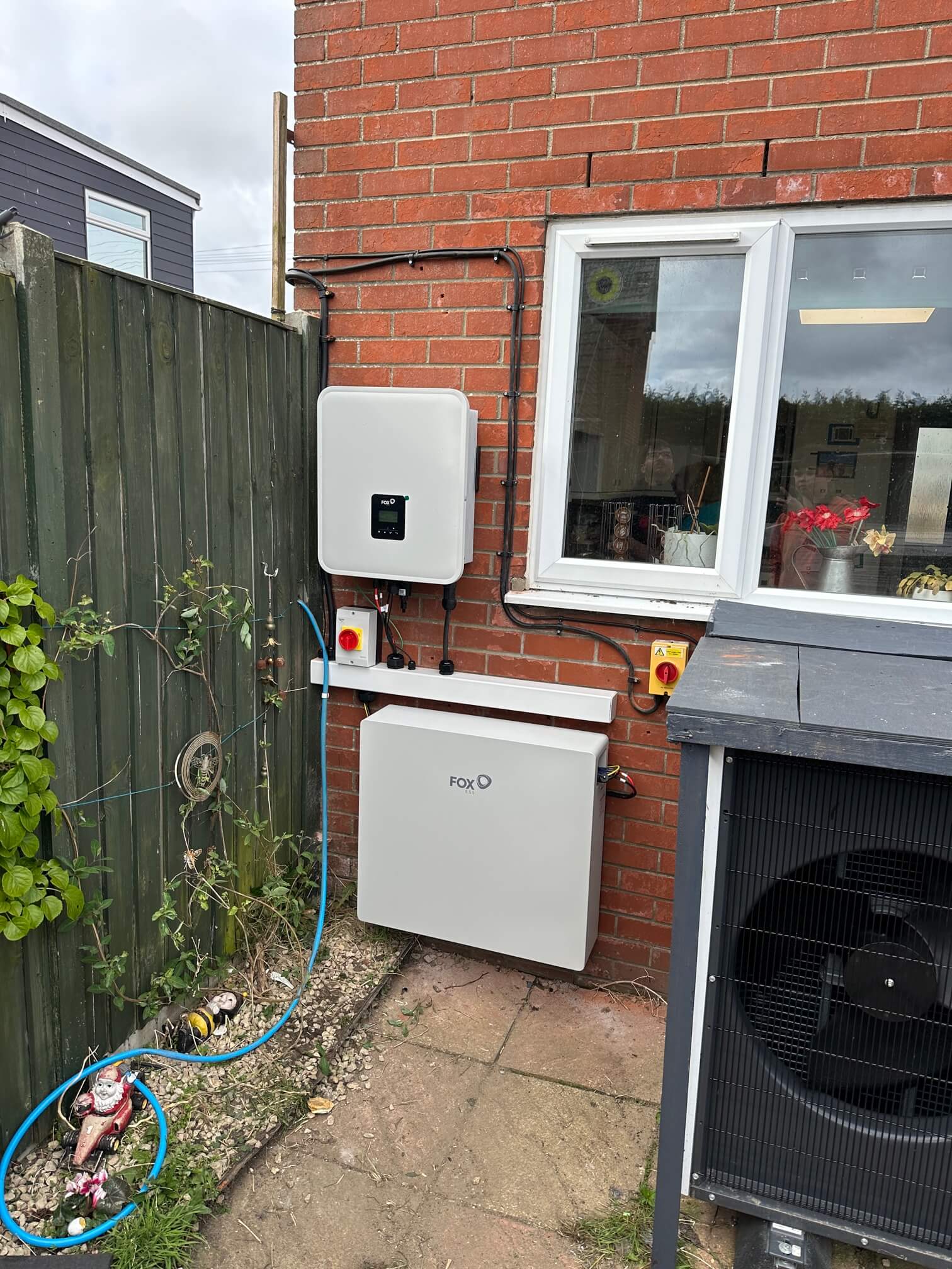 Fox ESS battery system installed next to the existing heat pump