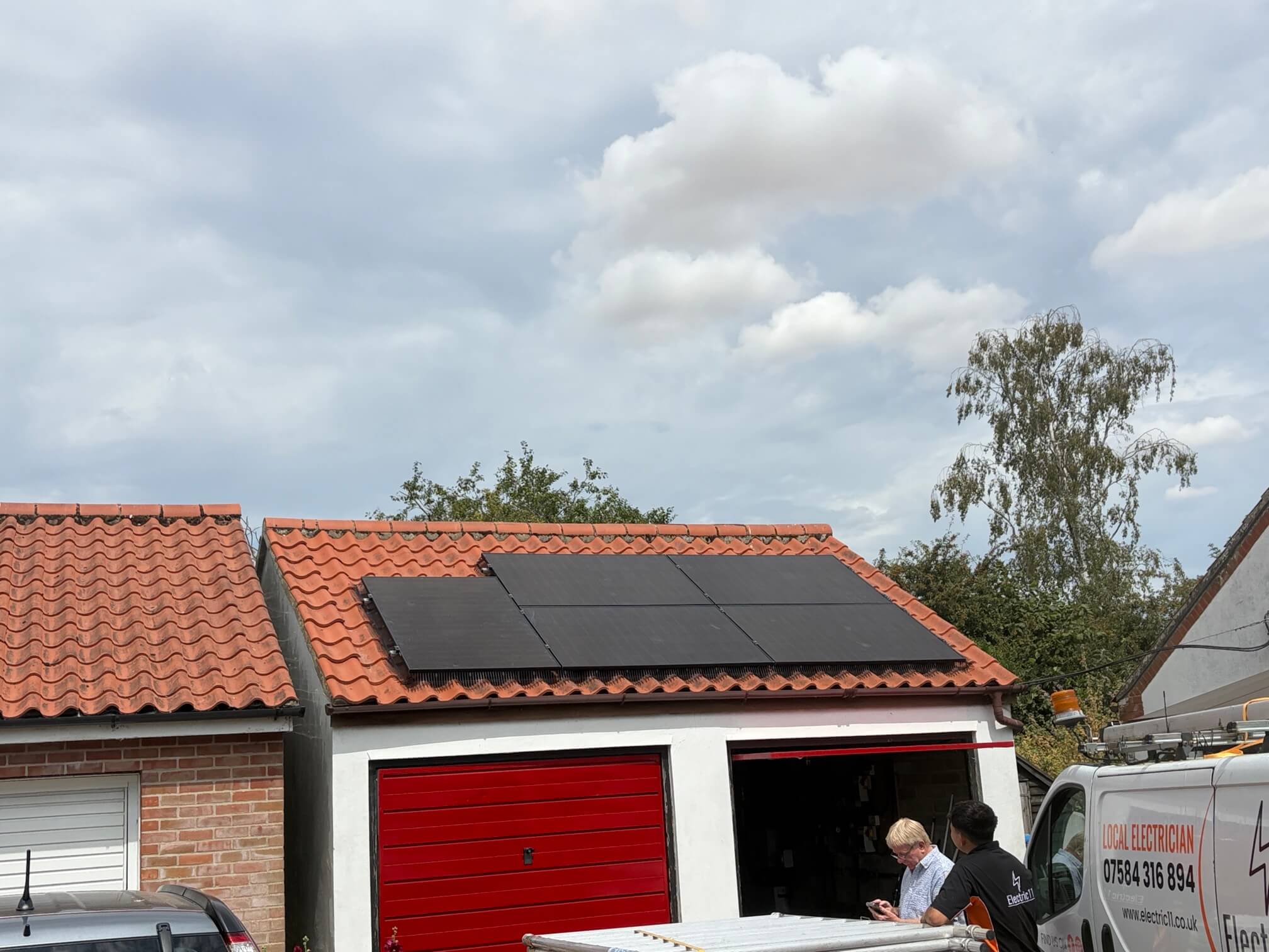 Completed all-black solar panel array on the garage roof near Diss