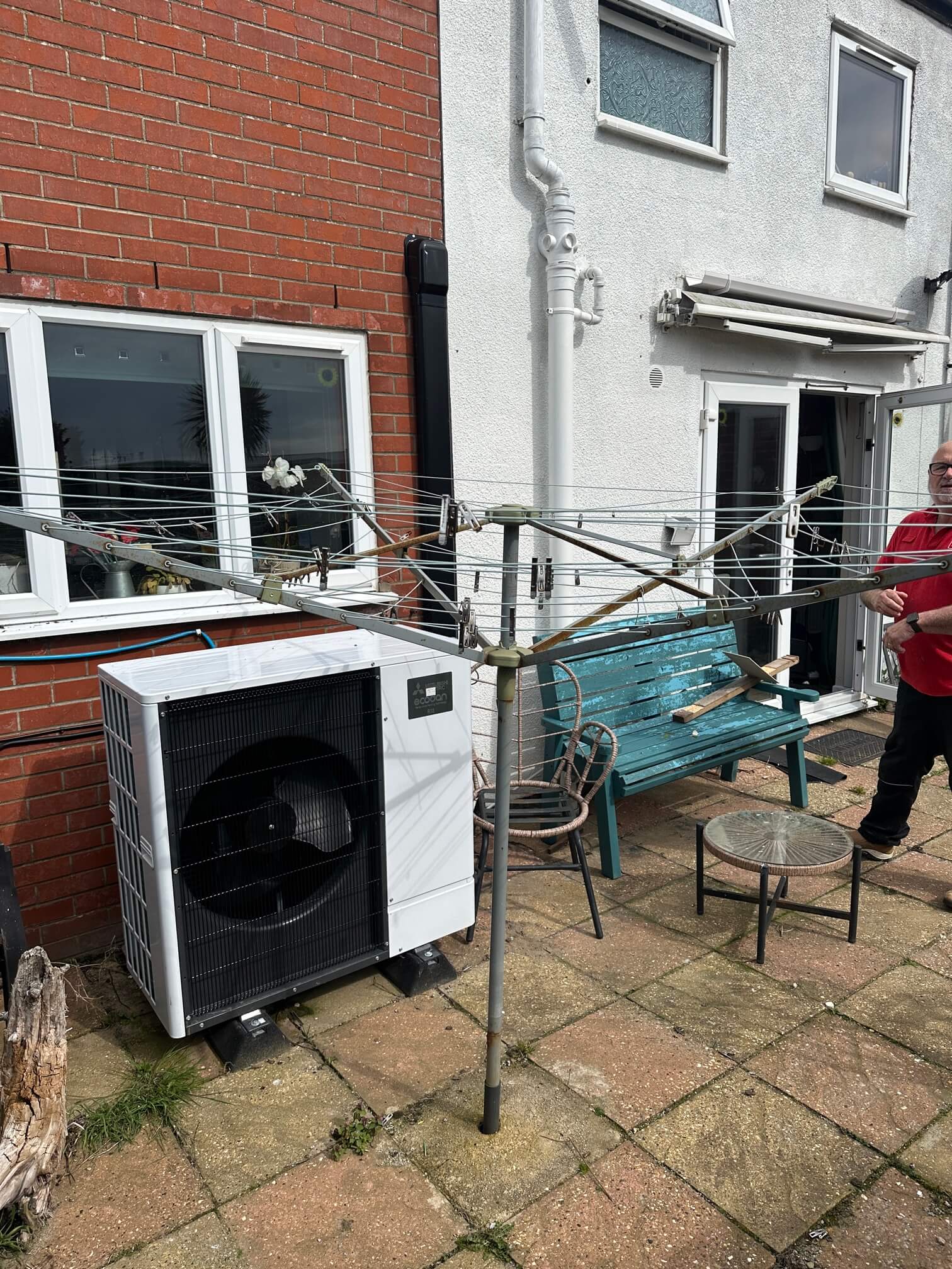 Existing outdoor heat pump beside the planned battery installation area