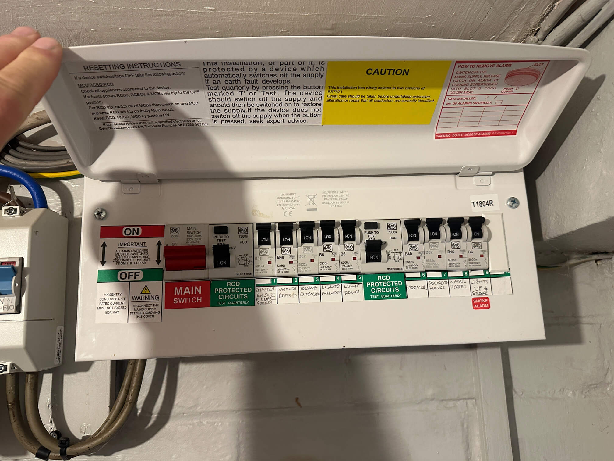 Open consumer unit showing existing circuits at a North Lopham home