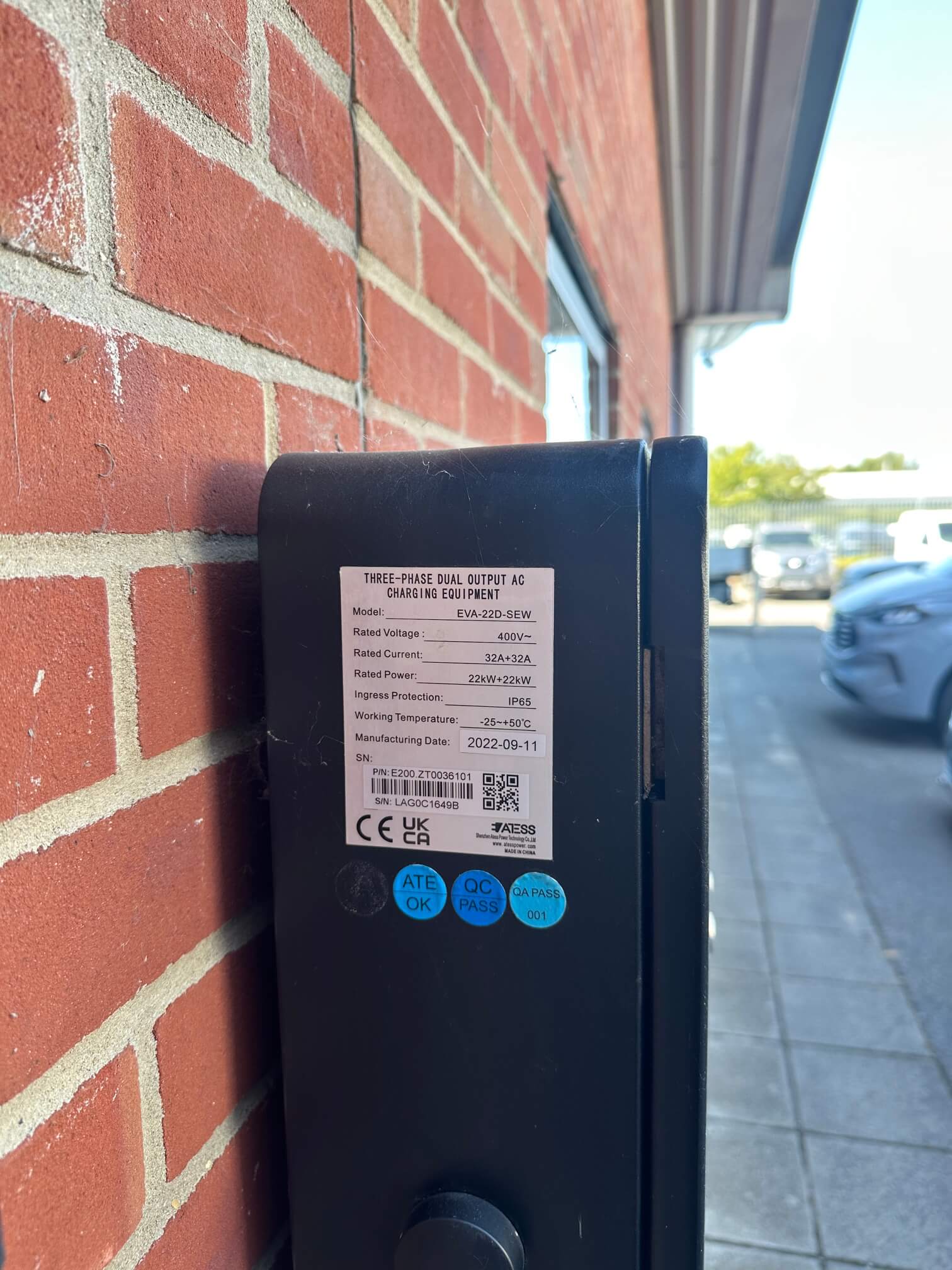 Rating label on a dual-output EV charger photographed at a Wymondham business