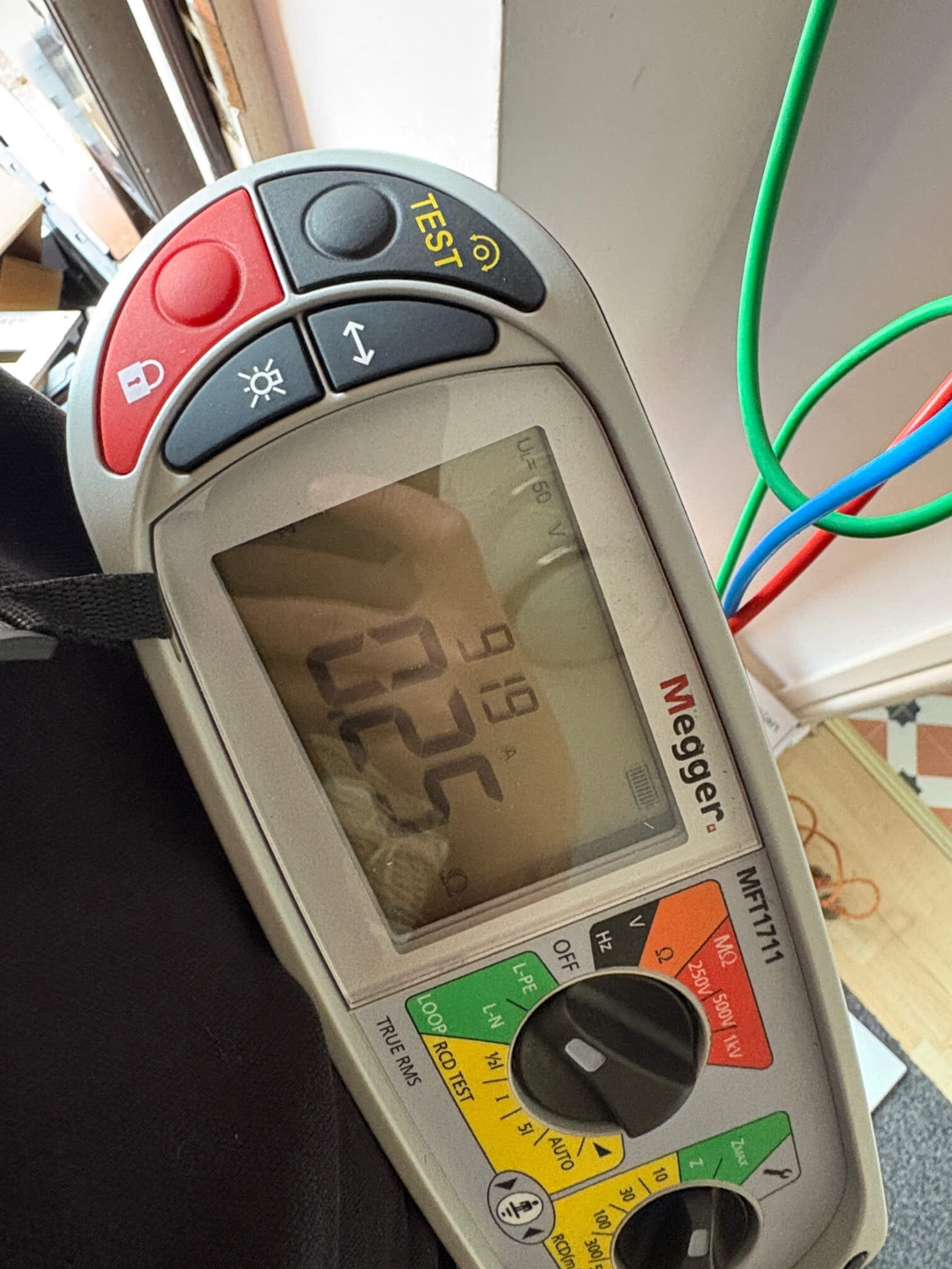 Megger multifunction tester displaying a reading during electrical testing