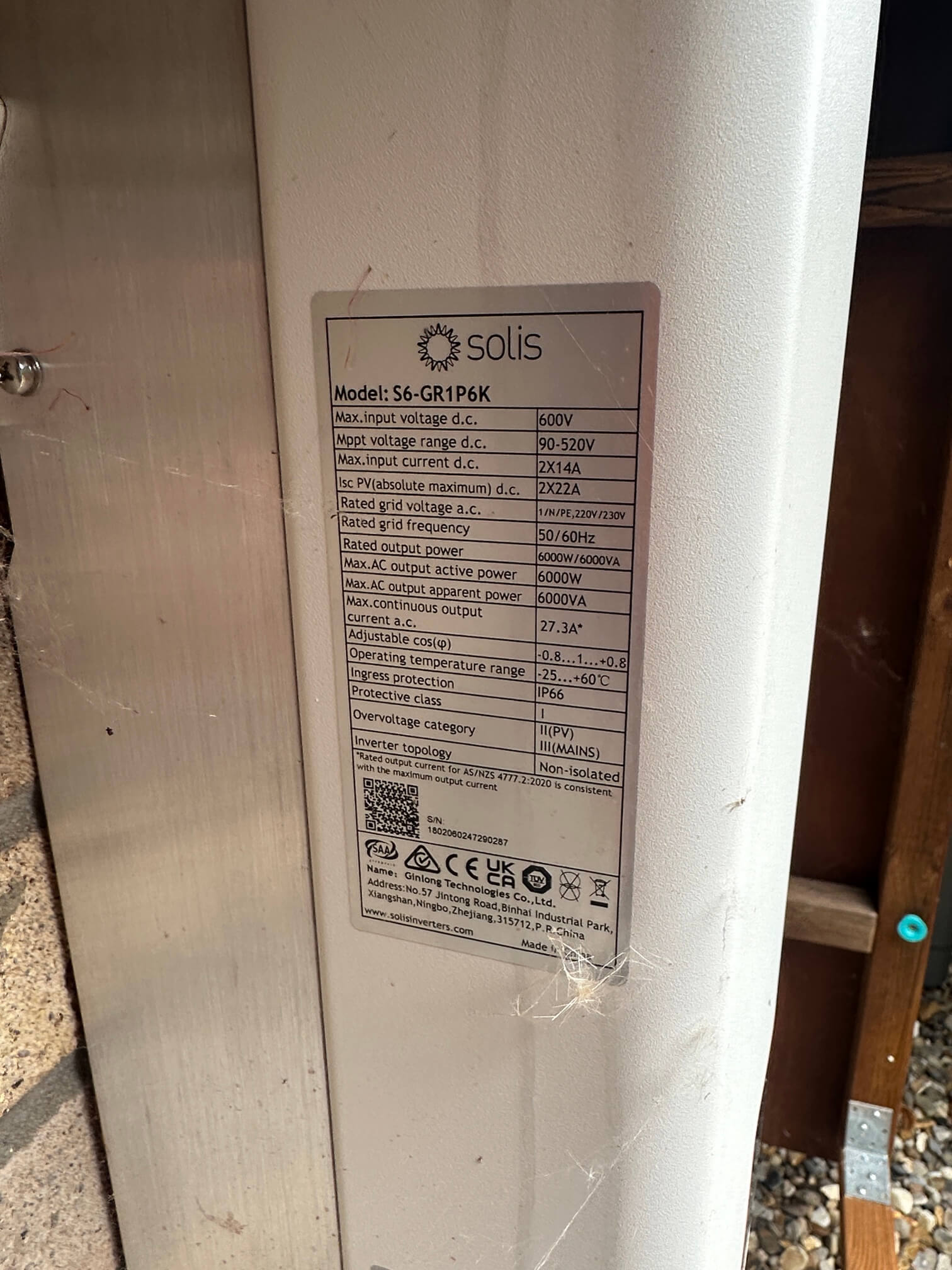 Close-up of the identification label on a white Solis inverter.