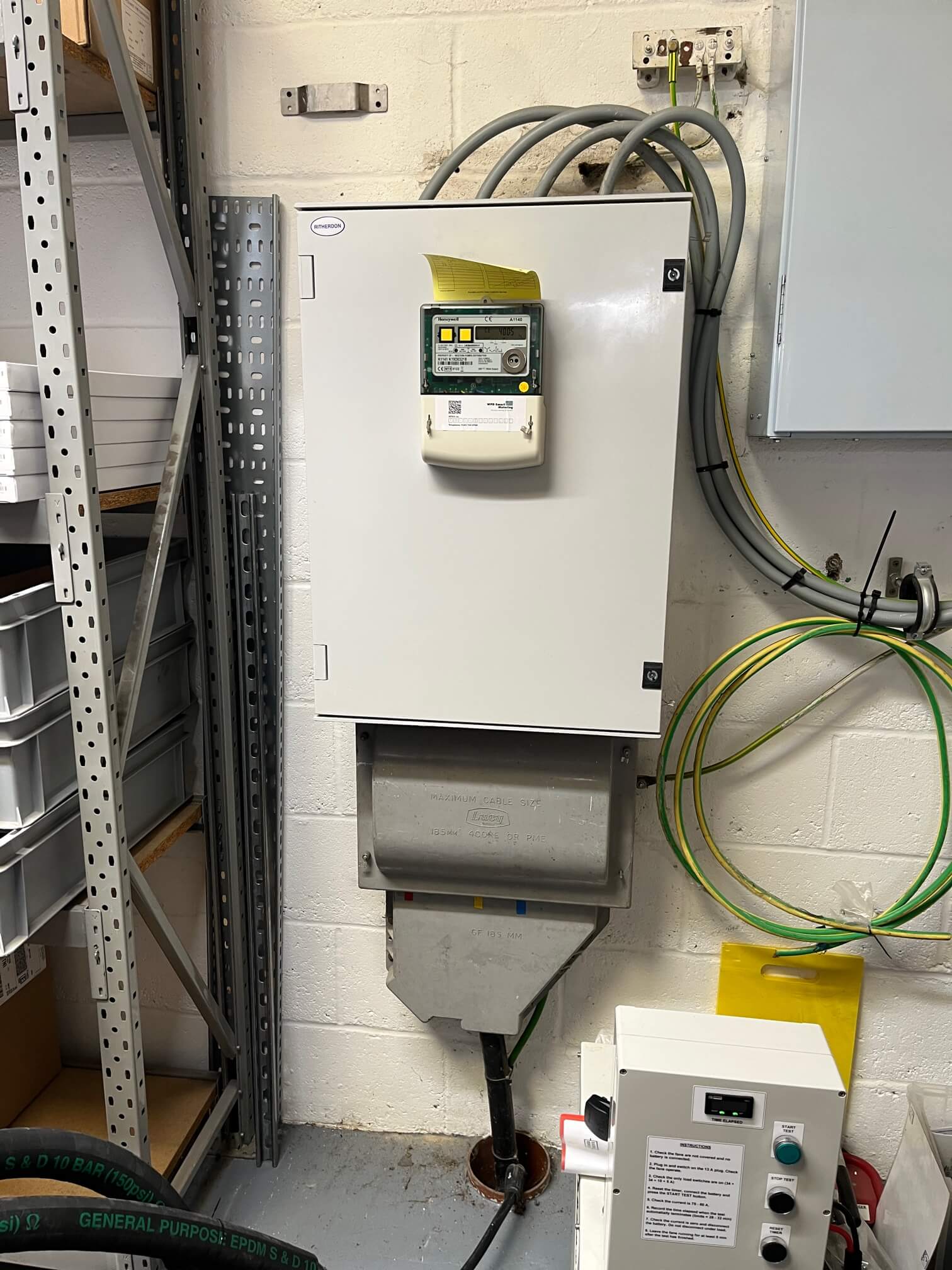 Electricity meter cabinet, incoming supply enclosure and adjacent earthing cables at the Station Road property.